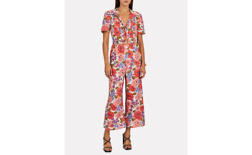 Jumpsuit de Zimmermann que destaca por su estampado de flores coloridas y  cinto 19,332 MXN