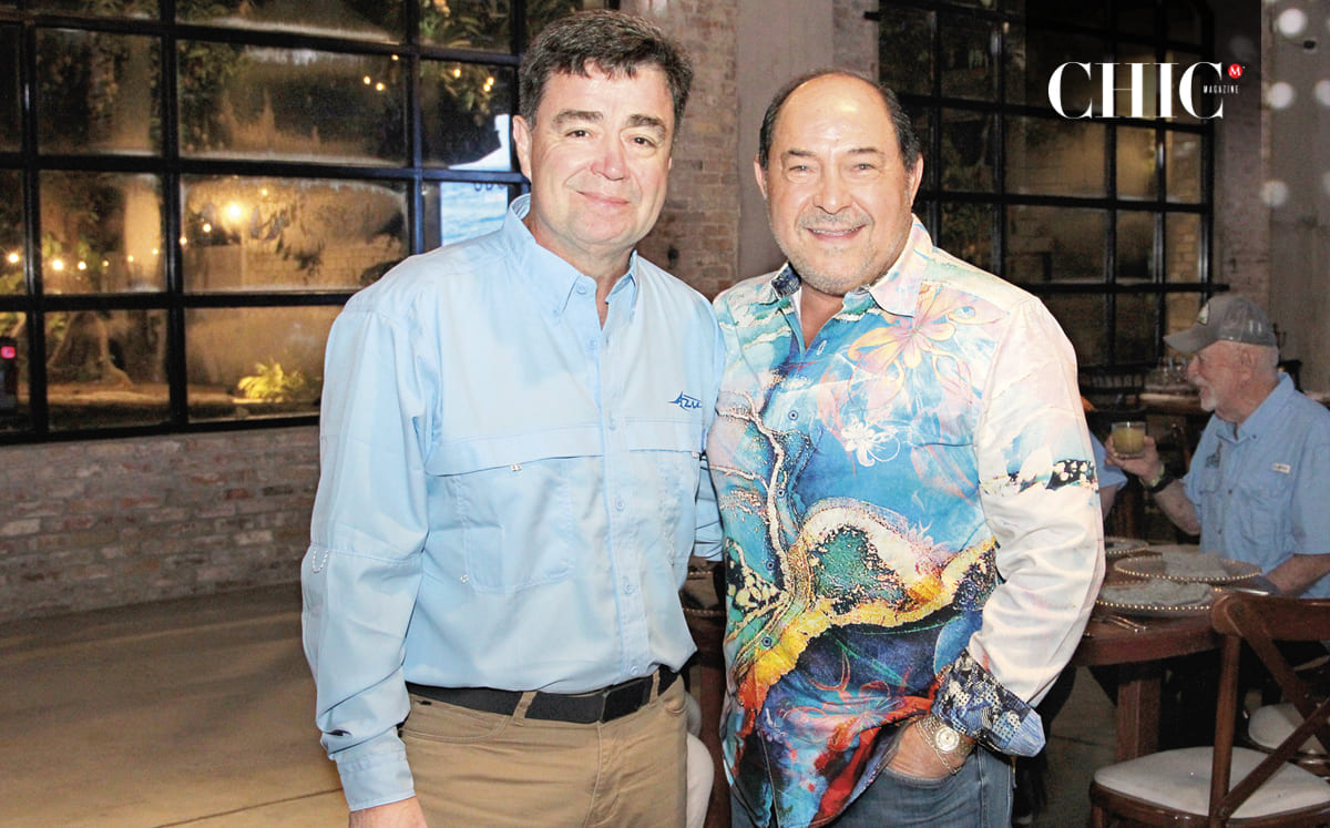 Carlos Fuentes y Chucho Moses disfrutando de la cena previa al Torneo de Pesca
